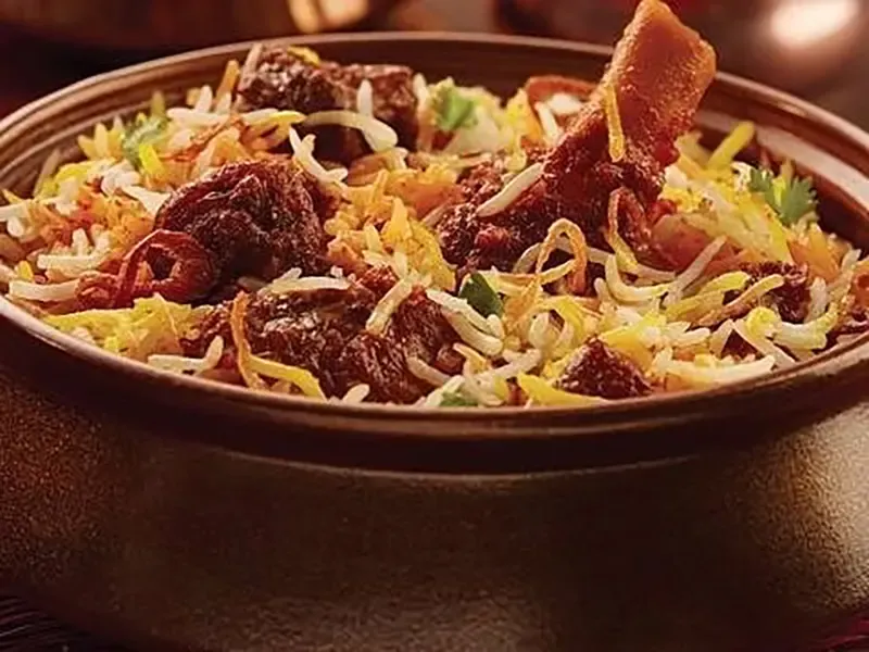 Traditional Hyderabadi biryani preparation