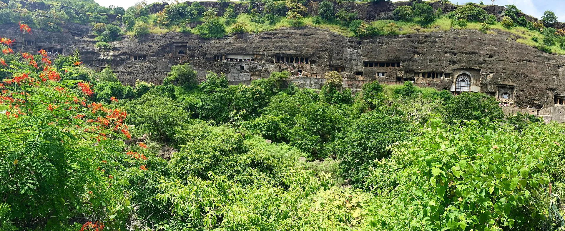 The horseshoe-shaped cliff of rock-cut caves at Ajanta in Maharashtra