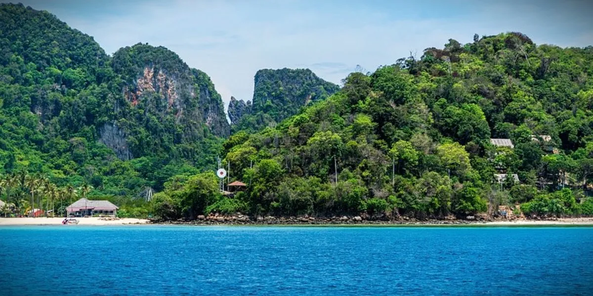 The white sand and turquoise water of Radhanagar Beach on Havelock Island, Andaman Islands