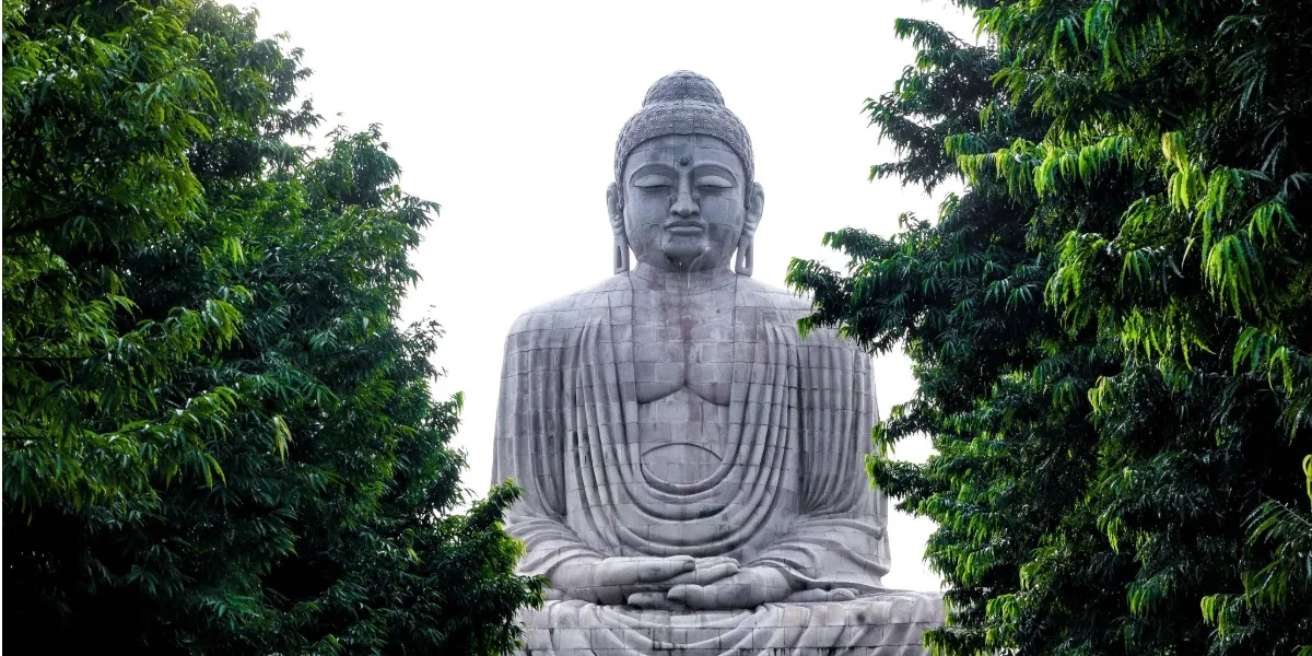 The carved spire of the Mahabodhi Temple rising above its complex at Bodh Gaya