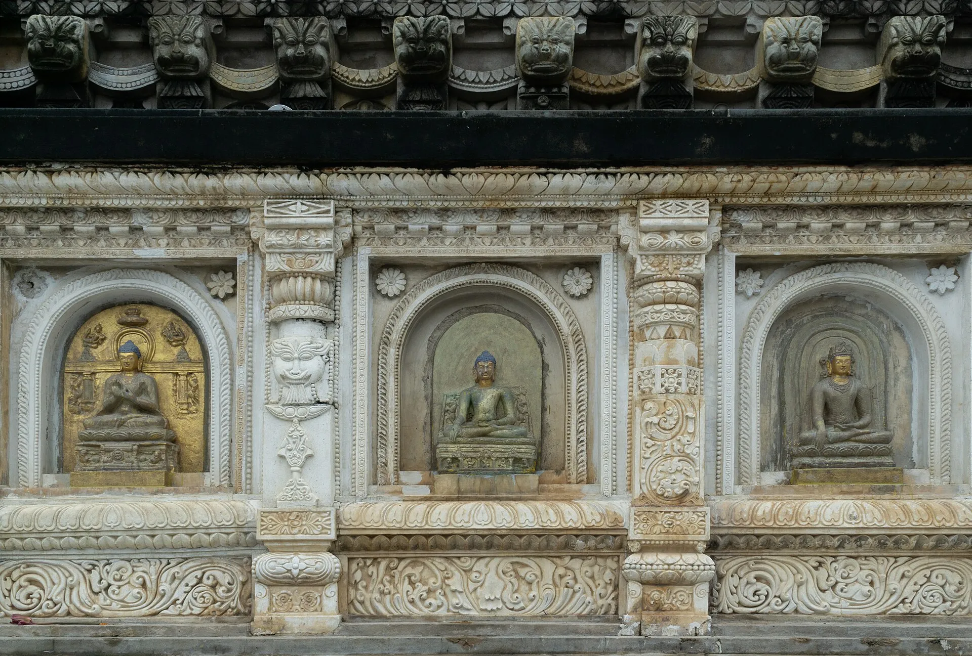 The carved spire of the Mahabodhi Temple rising above its complex at Bodh Gaya