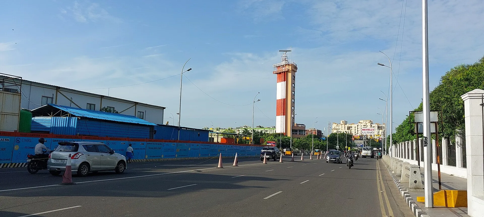 The red and white lighthouse rising above Marina Beach in Chennai