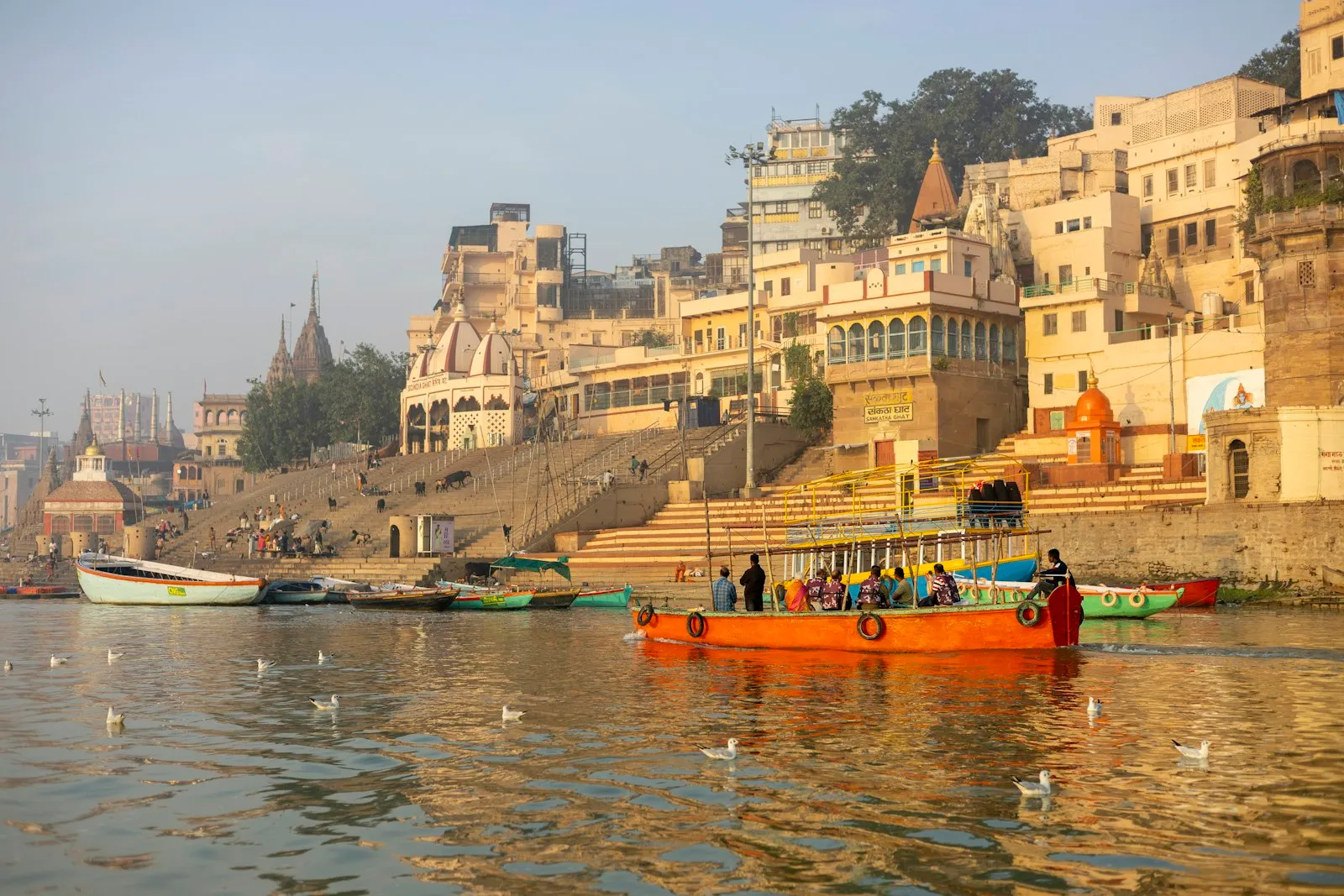 Wooden boats moored along the Ganges at the Varanasi ghats