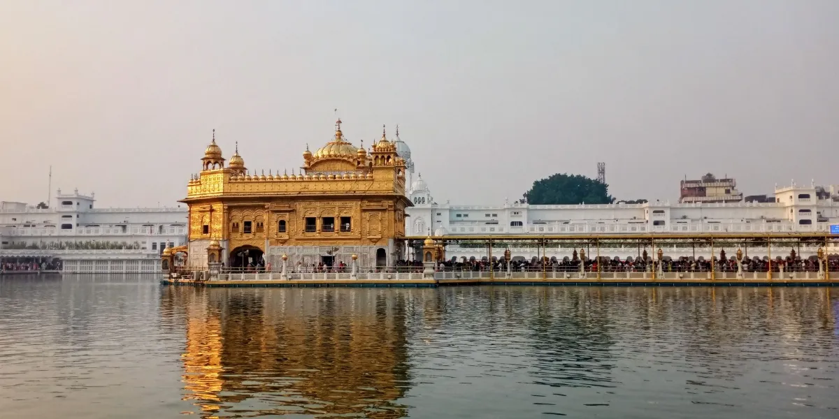 The gilded Harmandir Sahib reflected in its sacred pool at Amritsar