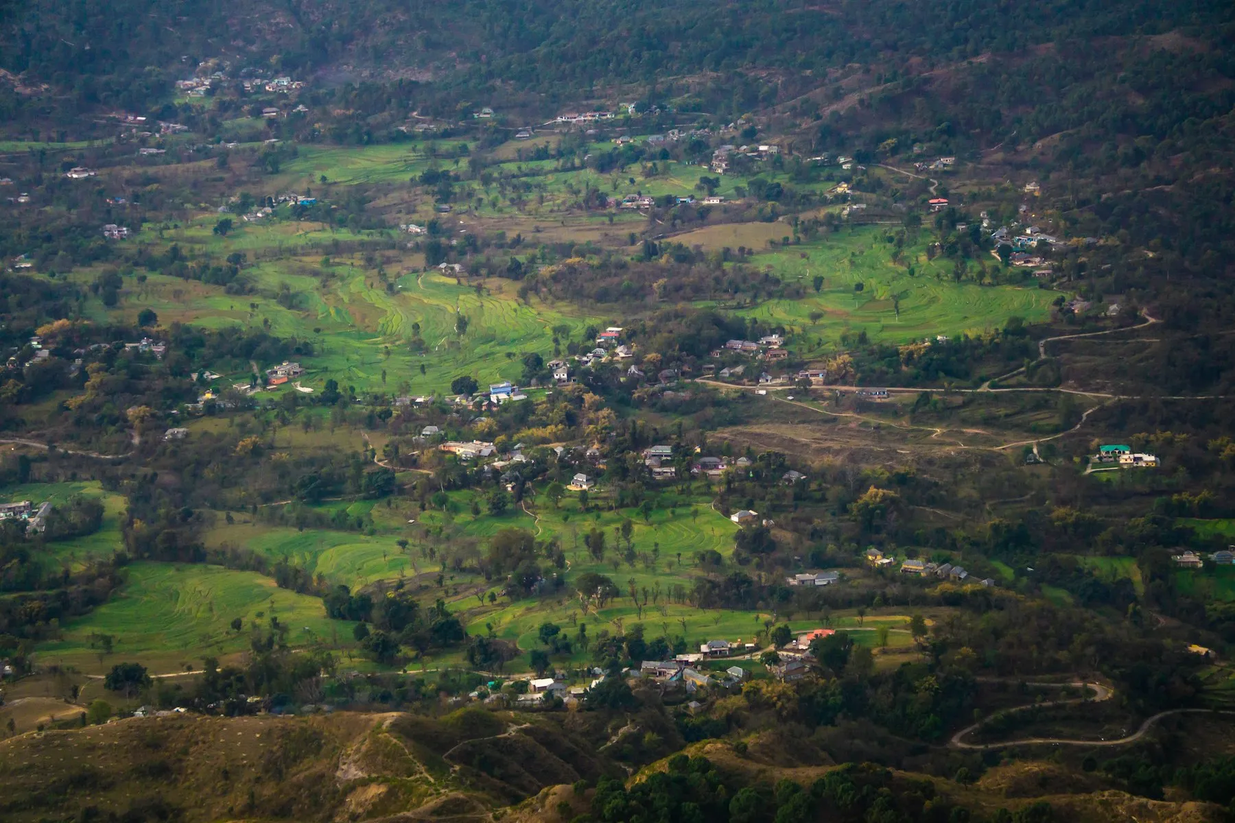An aerial view of the Kangra Valley below the Dhauladhar range