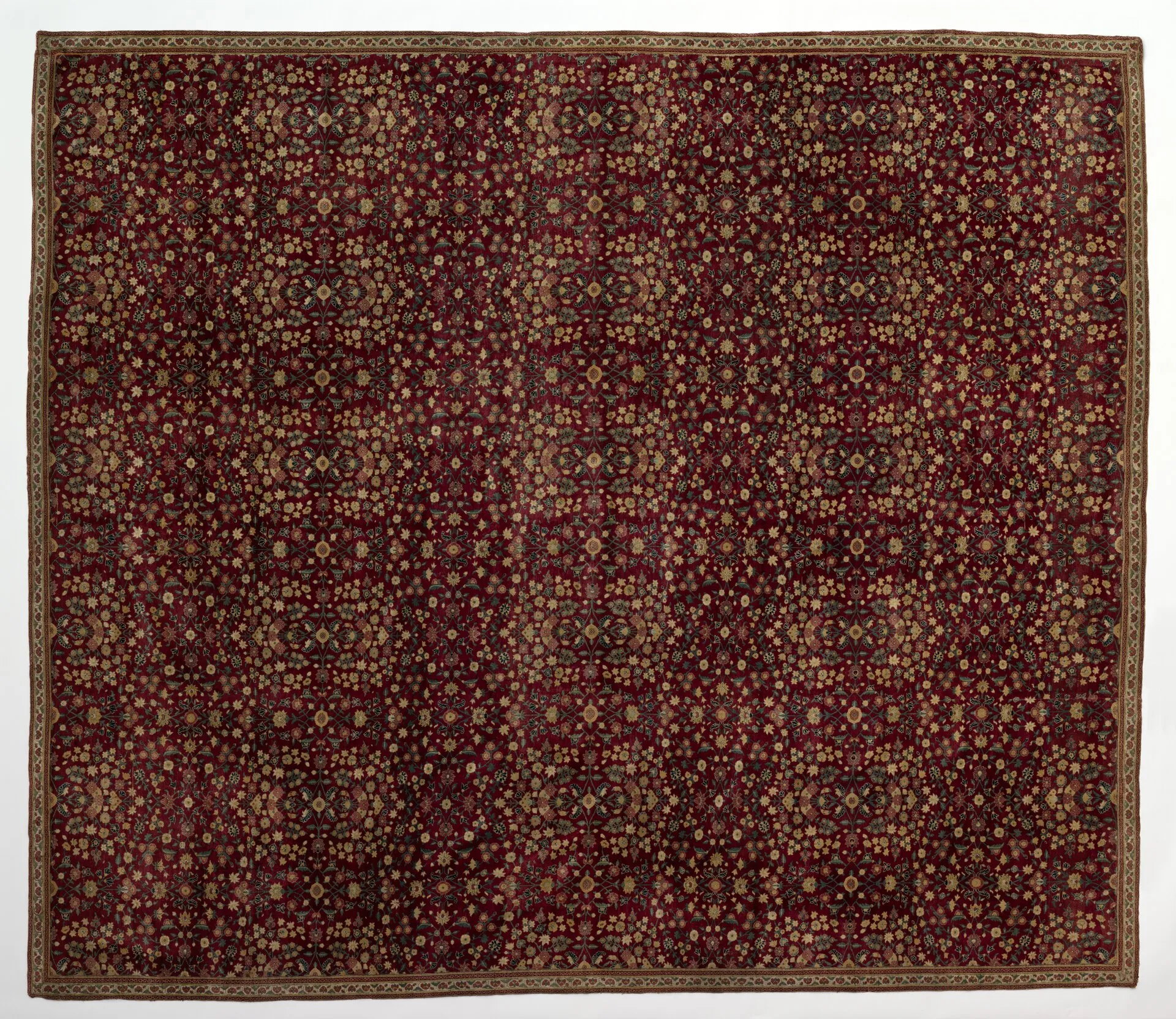 A finely woven 17th-century Kashmiri woollen carpet with millefleurs decoration