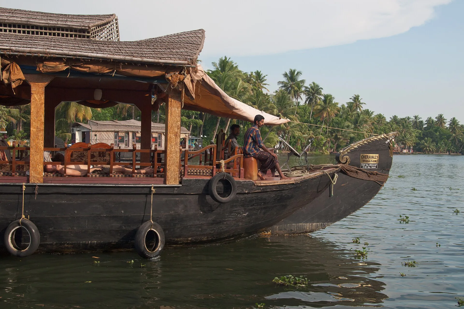 A traditional houseboat moored on the palm-fringed backwaters of Kerala
