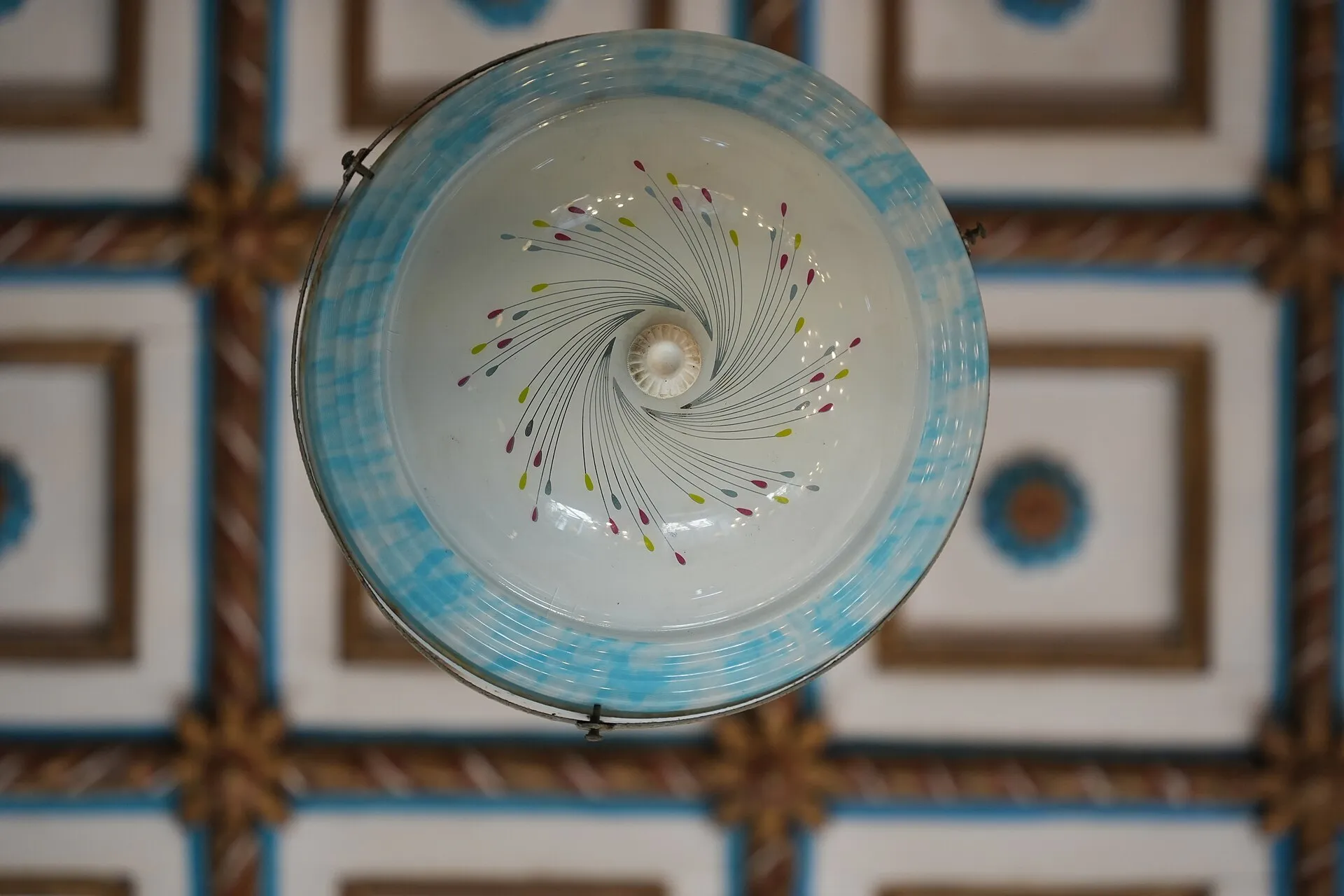 The interior of the Paradesi Synagogue with hanging lamps in Jew Town, Kochi