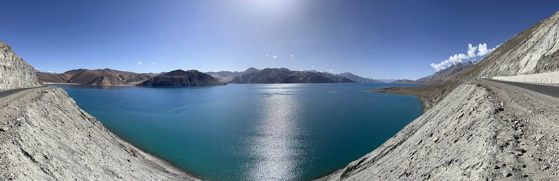 The blue waters of Pangong Tso framed by barren high-altitude mountains in Ladakh
