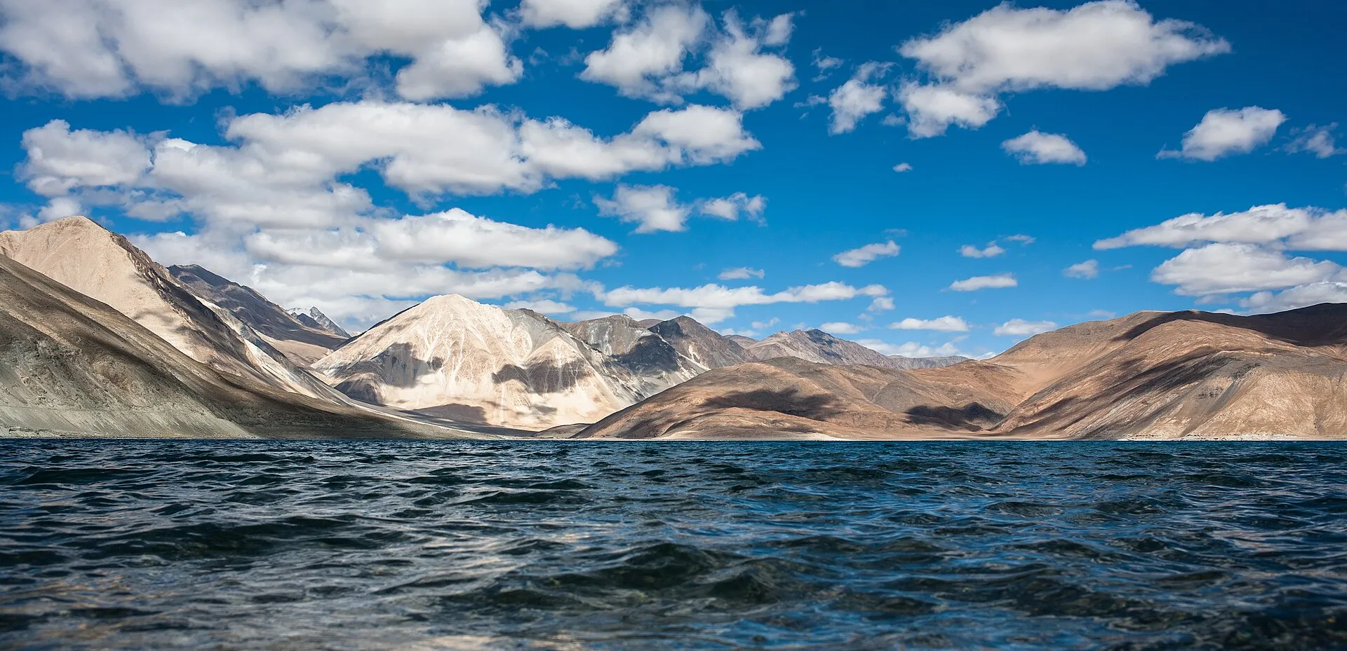 The deep blue waters of Pangong Tso framed by barren Ladakhi mountains