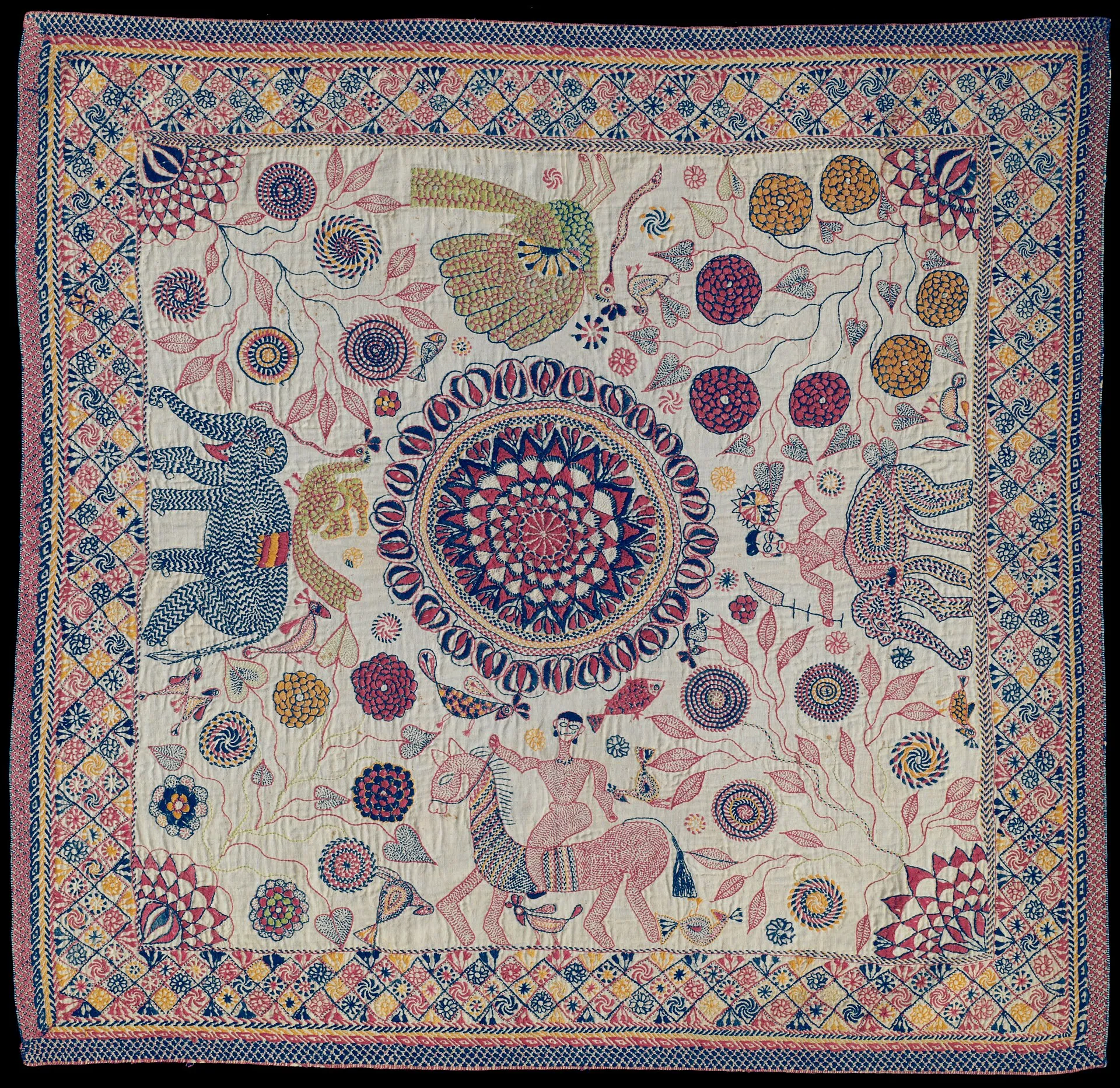 A Bengali kantha embroidered quilt covered in dense running-stitch motifs