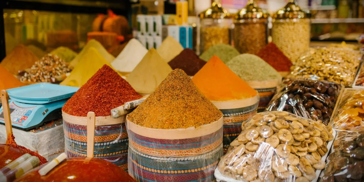 Sacks of dates and dry goods at a vendor's stall in the Khari Baoli spice market of Old Delhi