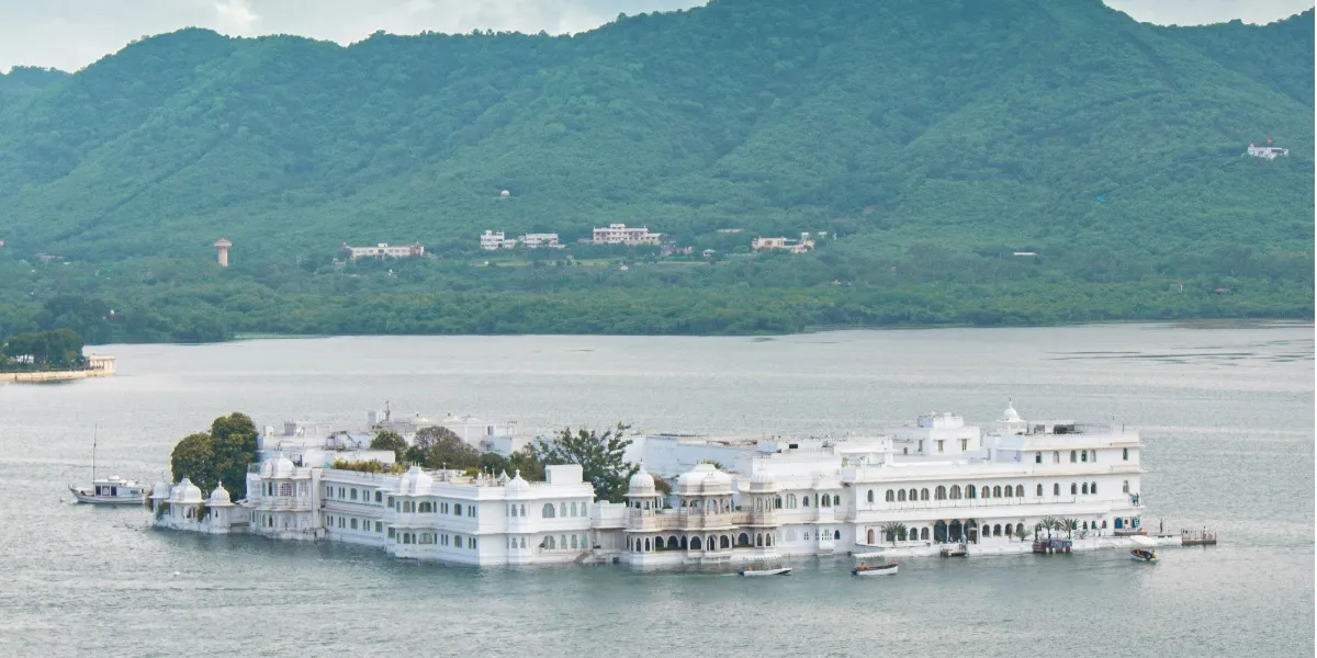 The Taj Lake Palace glowing at dusk on Lake Pichola, Udaipur