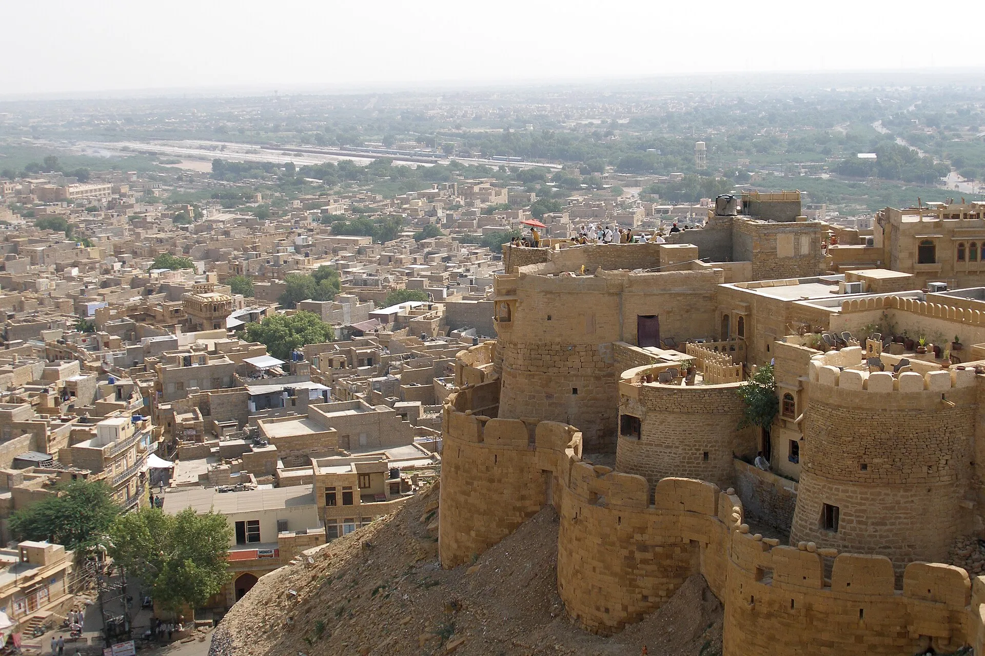 The honey-coloured ramparts of Jaisalmer Fort rising above the desert in Rajasthan