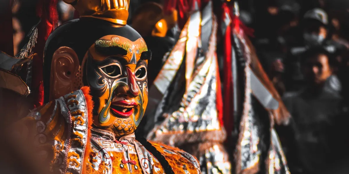 Masked dancers performing a ceremonial cham dance at a Bhutanese Tsechu