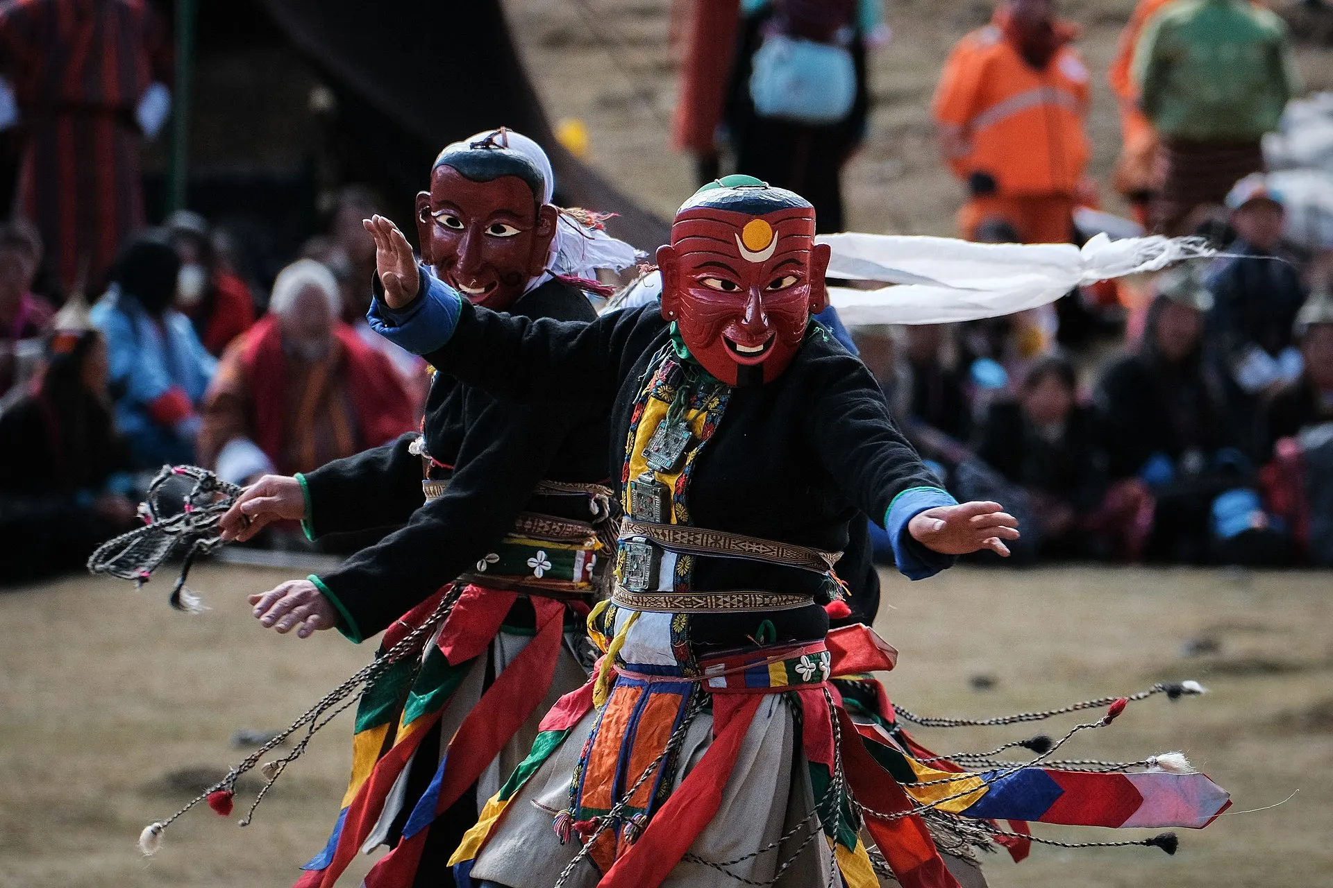 Masked dancers performing a ceremonial cham dance at a Bhutanese Tsechu
